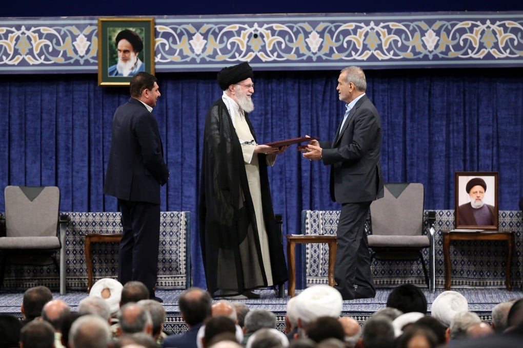 Iranian supreme leader Ayatollah Ali Khamenei (middle) hands his seal of approval to newly-elected President Masoud Pezeshkian. Photo: dpa