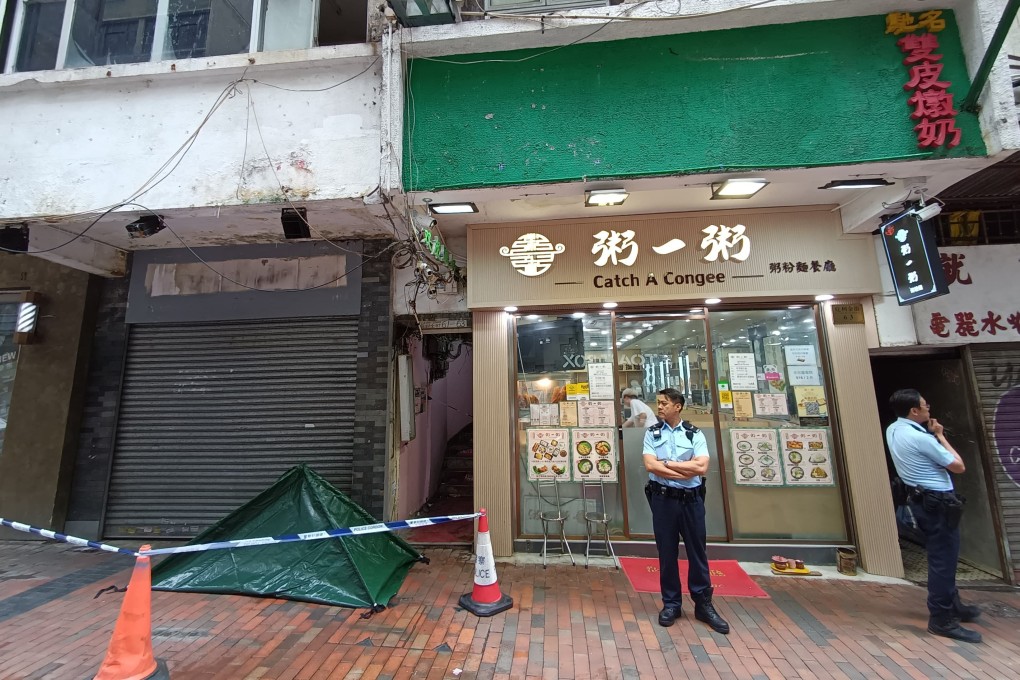 Police stand guard near where a man was found dead in Bowring Street in Jordan in the early hours of Sunday. Photo: Handout