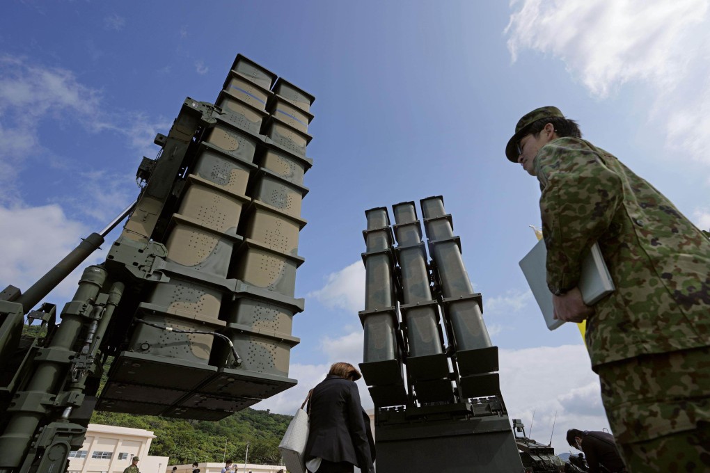 A Type-12 surface-to-ship missile (right) and a Type-3 medium-distance surface-to-air missile seen during a ceremony marking the opening of a Japanese military  garrison on Ishigaki island, in Okinawa prefecture in April 2023.  Photo: Kyodo