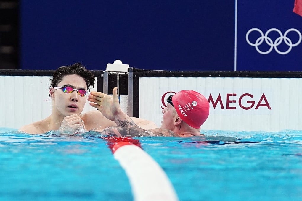 Qin Haiyang (left), who finished seventh in the 100m breaststroke final, accused doping testers of being part of a “European and American” plot to unsettle China’s team. Photo: Xinhua