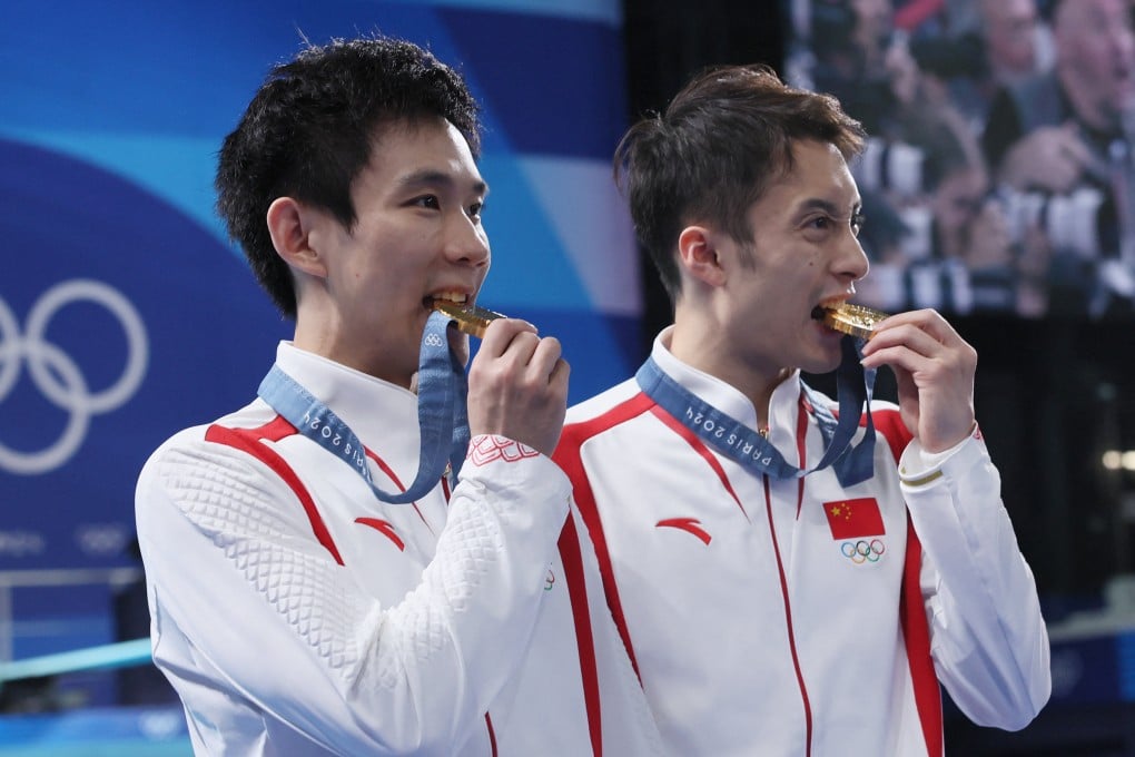 Gold medallists Lian Junjie and Yang Hao after winning the 10m platform synchronised diving competition. Photo: Reuters
