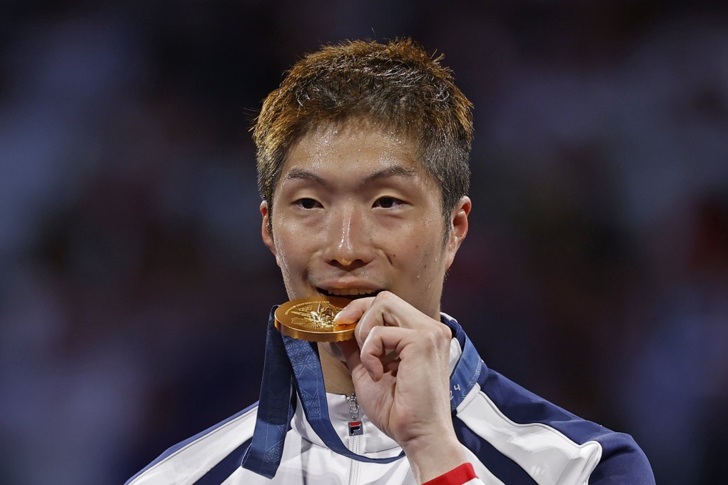 Cheung Ka-long receives his Olympic gold medal after winning the men’s foil title in Paris. Photo: EPA-EFE