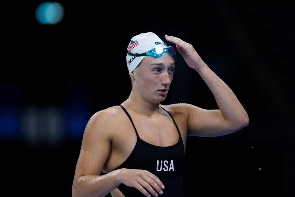 Emma Weber, sporting her cap, has a mystery lifeguard to thank for retrieving it after it was found at the bottom of the pool. Photo: AFP