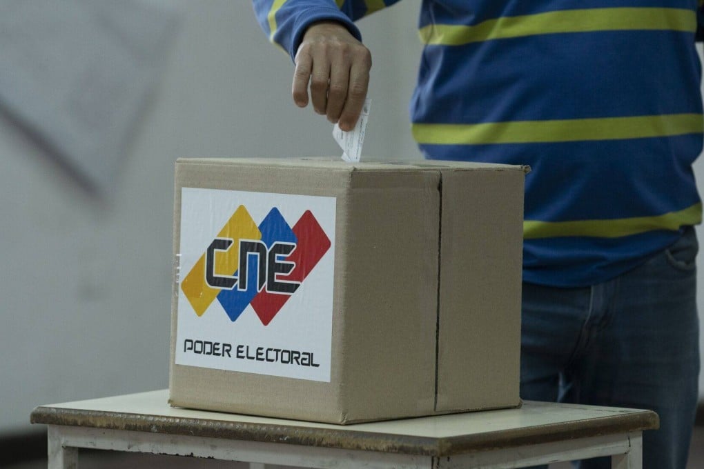 A voter casts a ballot during the presidential election in Caracas, Venezuela, on July 28. A regional body observing the election says the results cannot be recognised. Photo: Bloomberg