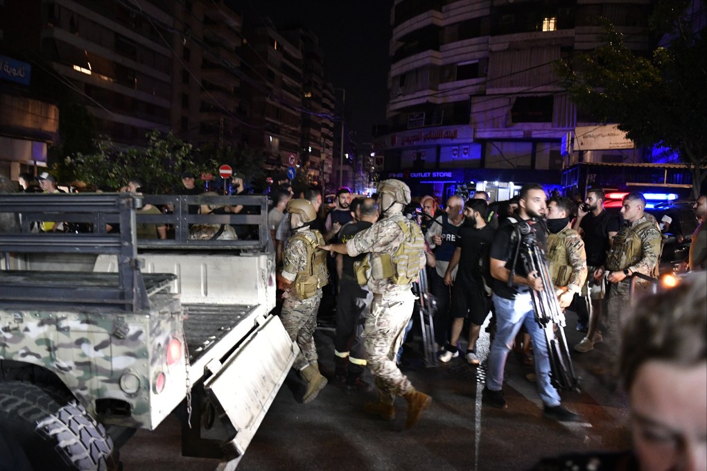 Soldiers near the site that was targeted by an Israeli strike in a southern suburb of Beirut, Lebanon on Tuesday. Photo:  EPA-EFE