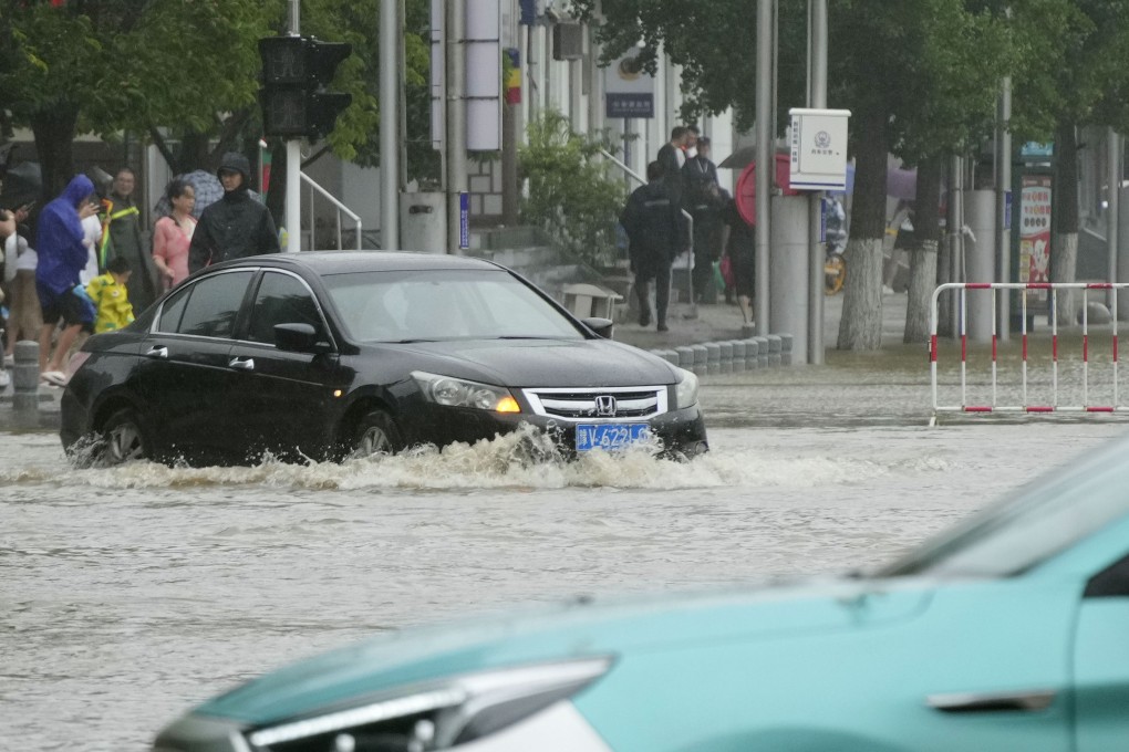 A street in Dandong, China, is flooded on Sunday. Photo: Kyodo