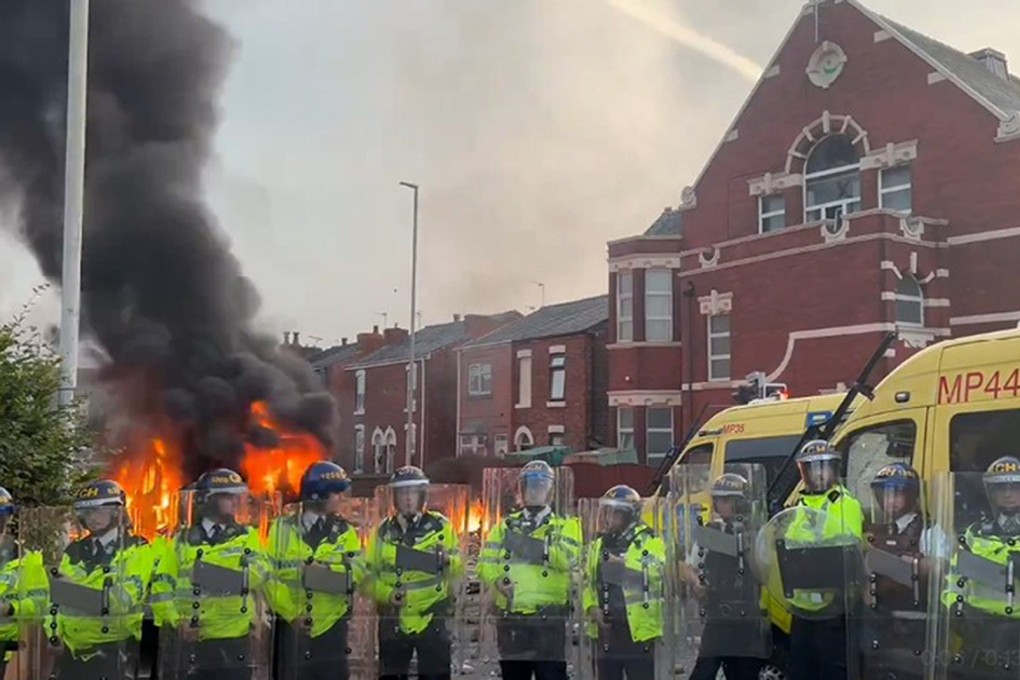A police van set on fire at a protest in Southport, England on Tuesday after three children were killed in a knife attack. Photo: PA Wire / dpa
