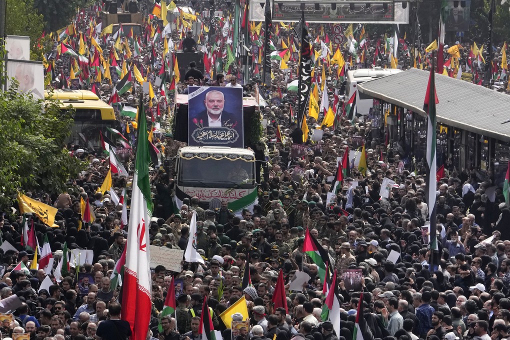 Iranians follow a truck carrying the coffins of Hamas leader Ismail Haniyeh and his bodyguard in Tehran, Iran. Photo: AP