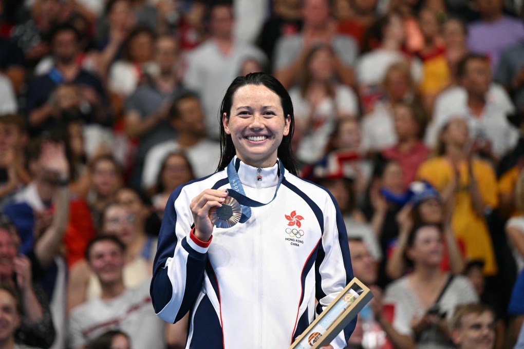 Hong Kong’s Siobhan Haughey receives her medal at the Paris La Defense Arena. Photo: AFP
