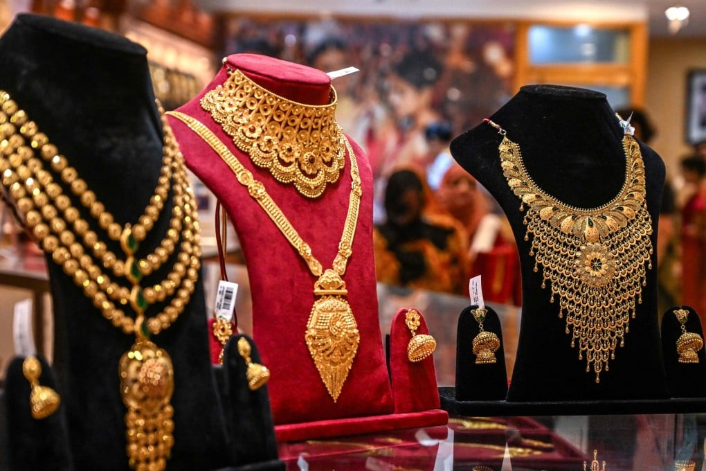 Gold jewellery on display inside a shop in Kolkata on July 23. Photo: AFP