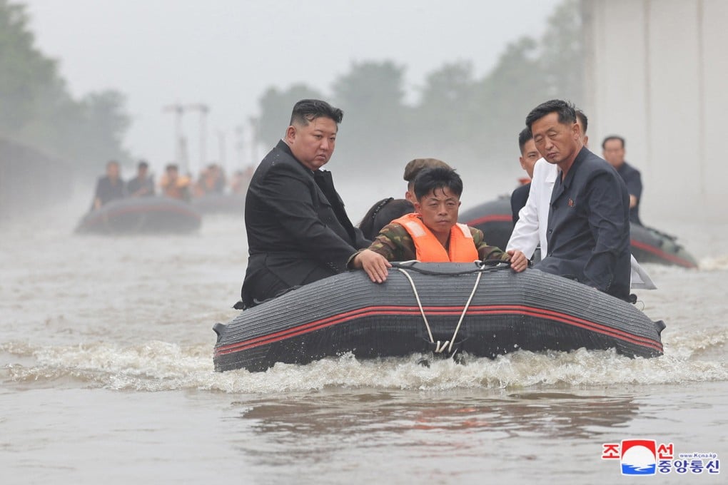 North Korean leader Kim Jong-un (left) visit a flood-affected area near the border with China, in North Pyongan province. Photo: Reuters