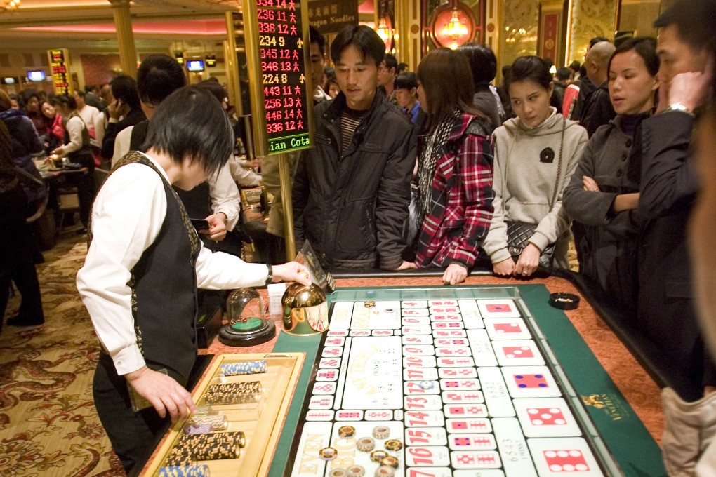 Gamblers placing bets in a Macau casino. Photo: Getty Images