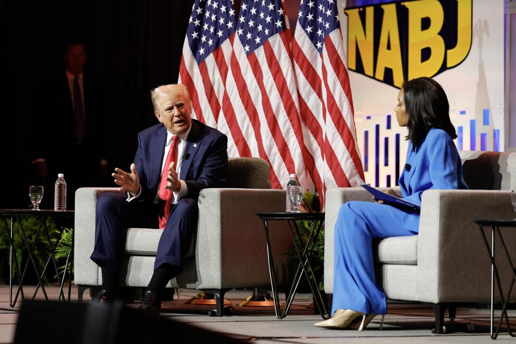 Republican presidential nominee Donald Trump answers questions as moderator and journalist Rachel Scott, right, looks on during the National Association of Black Journalists annual convention in Chicago on Wednesday. Photo: AFP / Getty Images / TNS