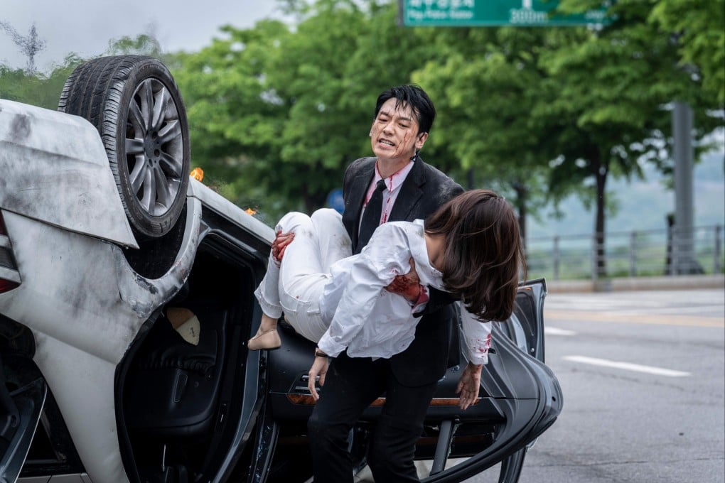 Korean actor-singer Rain as Seo Do-yoon carries Oh Wan-soo (played by Kim Ha-neul) in a still from K-drama Red Swan.