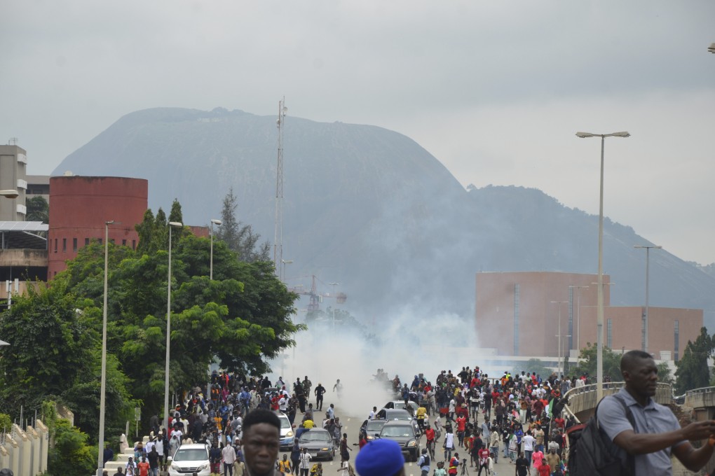 Police fire tear gas during a protest in Abuja, Nigeria, as people protest against the country’s worst cost-of-living crisis in a generation. Photo: AP