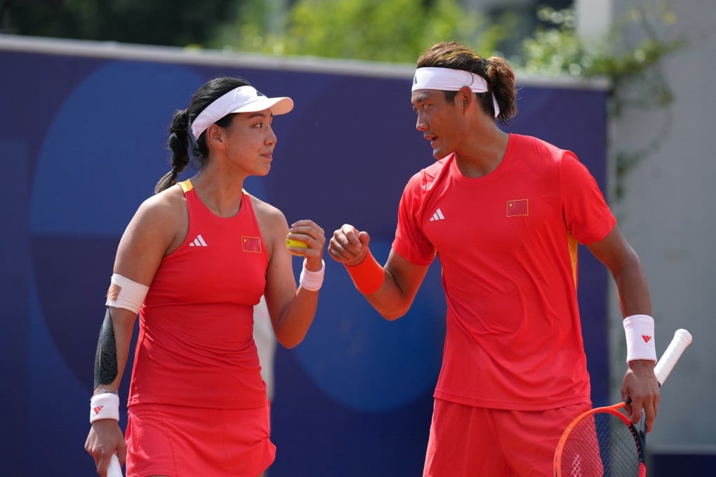 Wang Xinyu (left) and Zhang Zhizhen (right) are just one match away from winning a gold medal for China in the mixed doubles. Photo: Xinhua