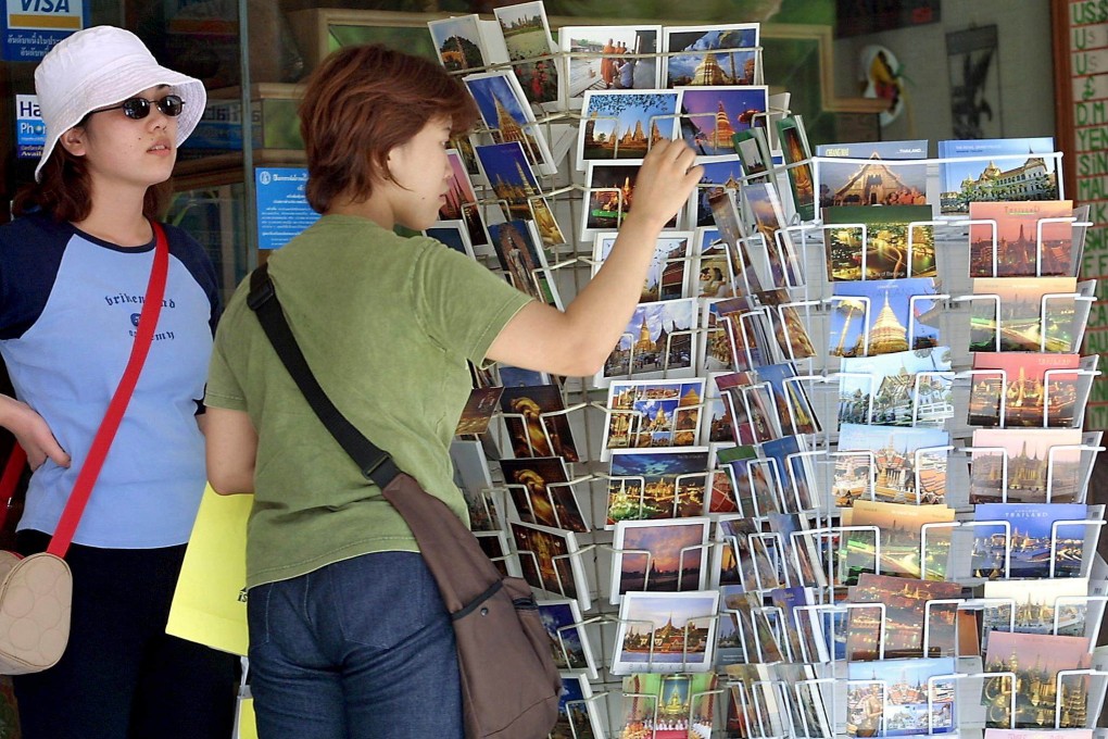 Postcards have been losing popularity for years, with travellers choosing to share photos online, but millennials are keeping the tradition of sending them alive, mailing more than any other section of the population, according to a British survey. Photo: AFP