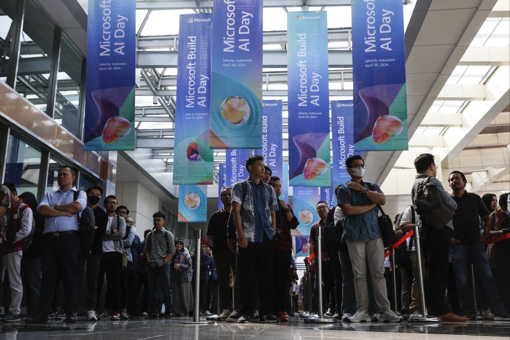 Participants queue to enter a venue during the Microsoft Build: AI Day event in Jakarta, Indonesia, on April 30. Microsoft announced it will invest US$1.7 billion US dollar to build cloud and Artificial Intelligence infrastucture in Indonesia in the next four years.  Photo: EPA-EFE