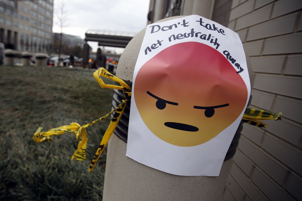A sign with an emoji reading “Don’t take net neutrality away”. Photo: AP
