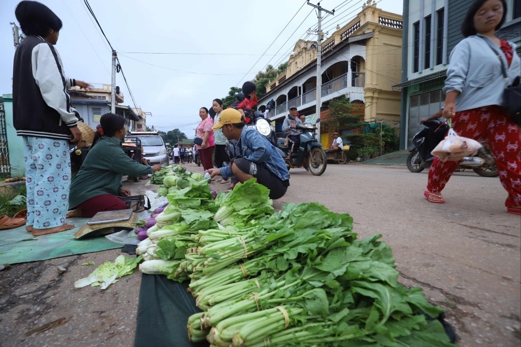 Vendors selling vegetables at a street market in Kyaukme in Myanmar’s northern Shan State earlier this month. Photo: AFP