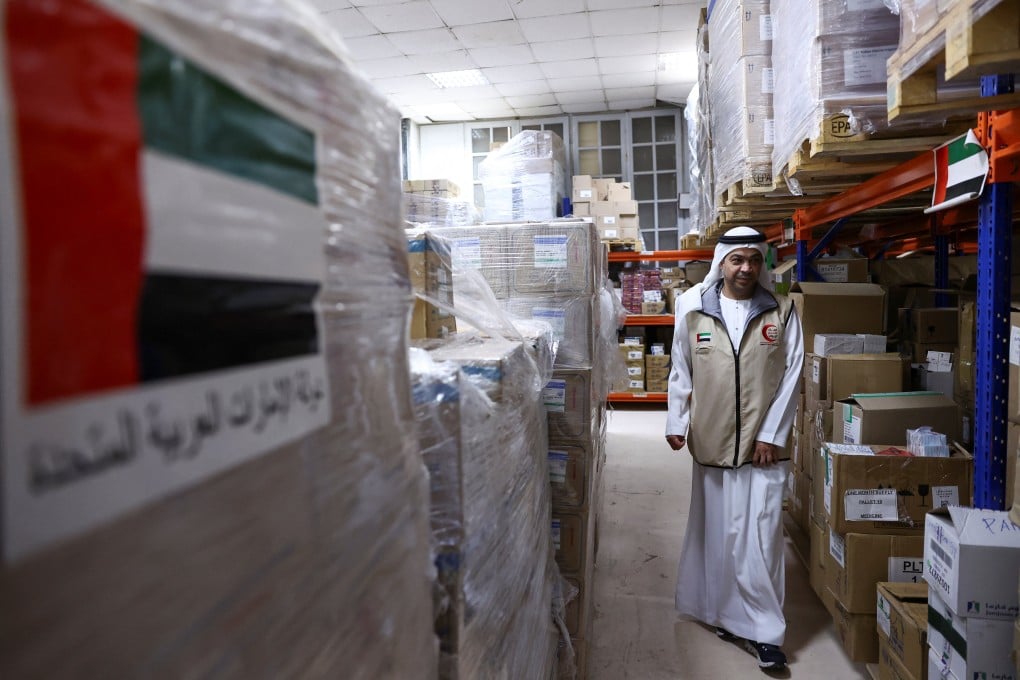 A United Arab Emirates aid worker walks among pallets of medical aid for Gaza at a UAE medical warehouse in Al Arish, Egypt. Photo: Reuters