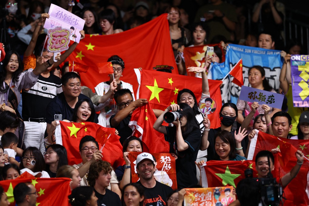 Chinese fans display signs backing Sun Yingsha during the table tennis women’s singles final. Photo: Reuters