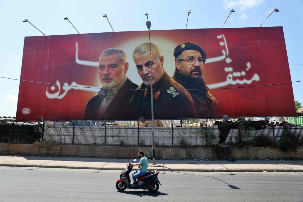 A billboard bearing portraits of slain leaders. Ismail Haniyeh of Hamas, Iranian Quds Force chief Qasem Soleimani (C), and Hezbollah senior commander Fuad Shukr, on the main road near the Beirut International Airport. Photo: AFP