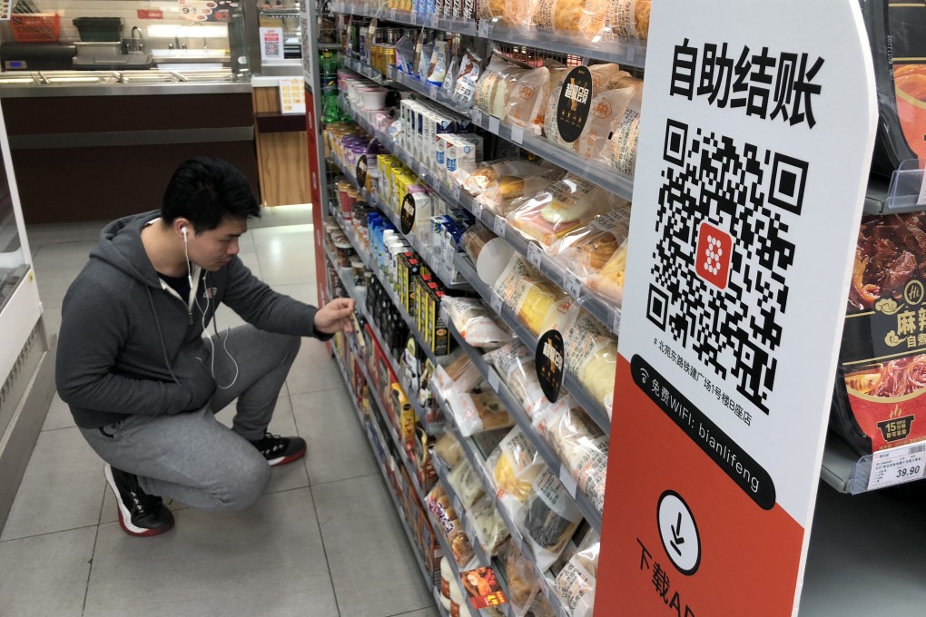 A customer shops at a Bianlifeng store in Beijing on February 27, 2018. Photo: Simon Song