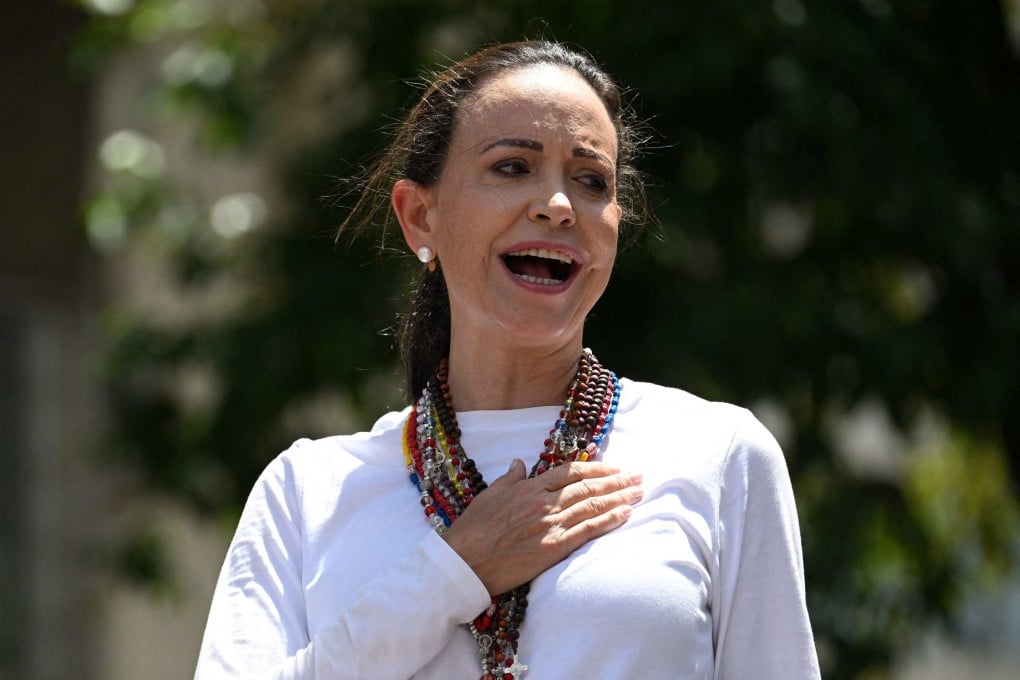 Venezuelan opposition leader Maria Corina Machado sings the national anthem during a demonstration in Caracas on Saturday. Photo: AFP