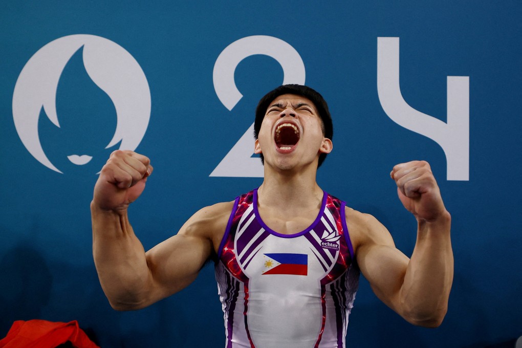 Carlos Yulo celebrates after winning gold in men’s gymnastics. Photo: Reuters