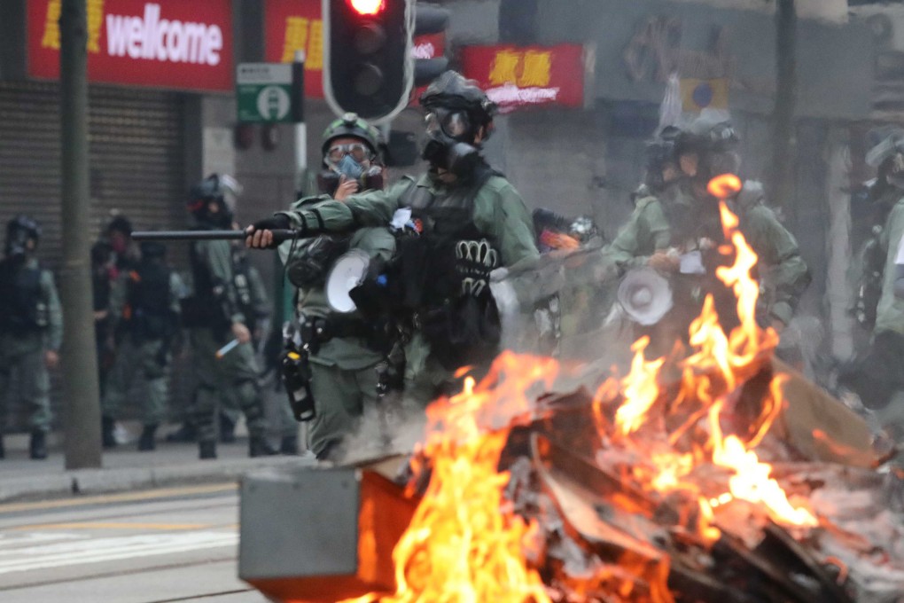 Police in riot gear face protesters in Wan Chai during the 2019 unrest. Photo: Felix Wong