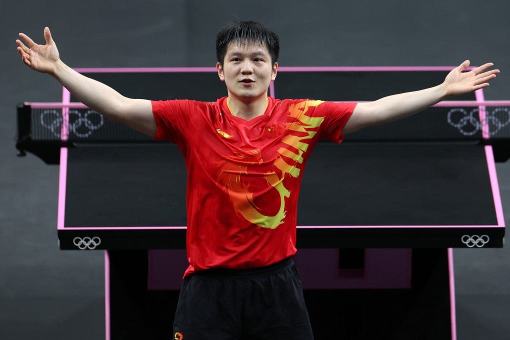 Fan Zhendong celebrates after winning a gold medal, which saw him complete a grand slam in table tennis. Photo: Xinhua