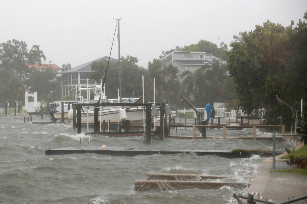 The Shore Acres neighborhood begins to flood from high tide in the Tampa Bay while Tropical Storm Debby approaches on Sunday. Photo: Reuters
