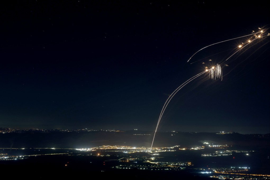 Projectiles fired from the Israeli Iron Dome air defensc system intercept missiles fired from southern Lebanon, over the upper Galilee, northern Israel on Sunday. Photo: EPA-EFE