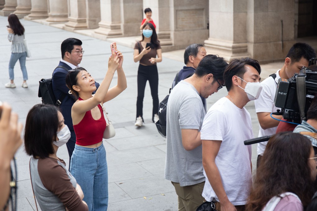 Tourists take pictures of a press event outside the Court of Final Appeal in 2023. Photo: Brian Wong