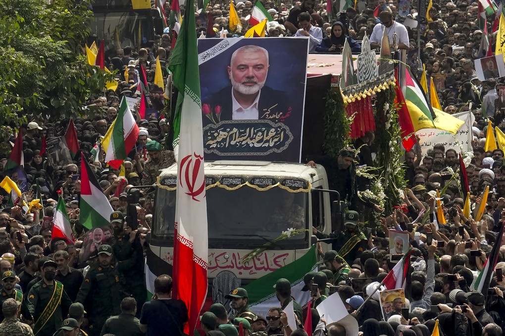 Iranians follow a truck carrying the coffins of Hamas leader Ismail Haniyeh and his bodyguard who were killed in an assassination blamed on Israel, during their funeral ceremony in Tehran, Iran on  August 1. Photo: AP