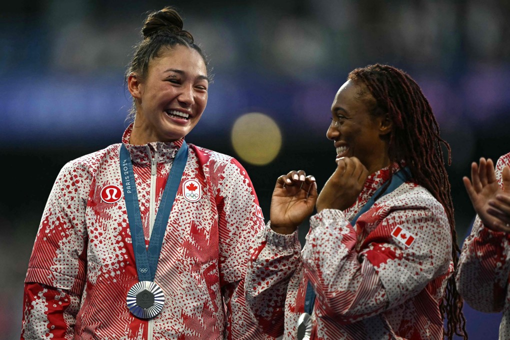 Florence Symonds (left) on the podium with teammate Charity Williams. Photo: AFP