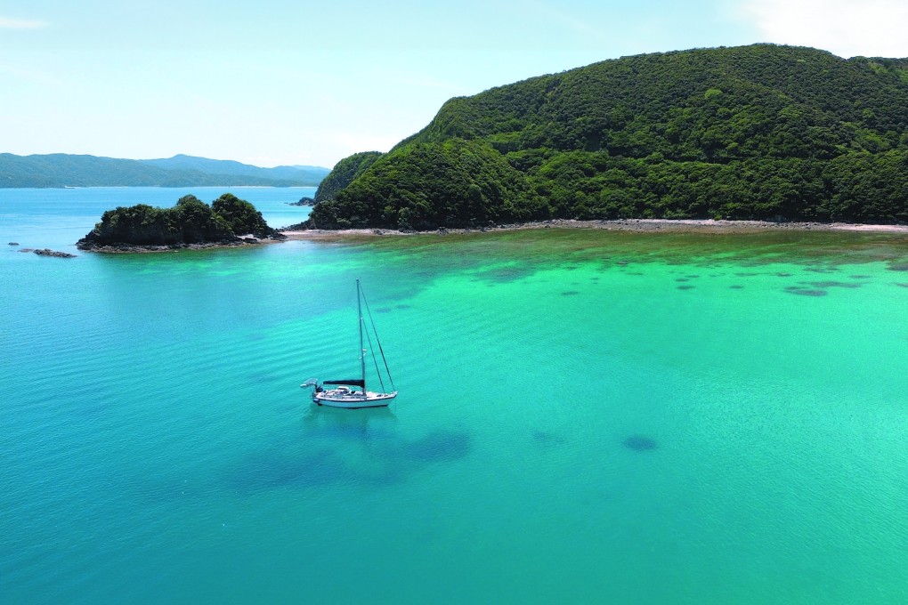 Embarking on a new life afloat, a couple formerly based in Hong Kong found their sea legs on a voyage to Taiwan, then on to Japan. Pictured is their boat Teng Hoi at anchor in Amami, Japan. Photo: Cameron Dueck