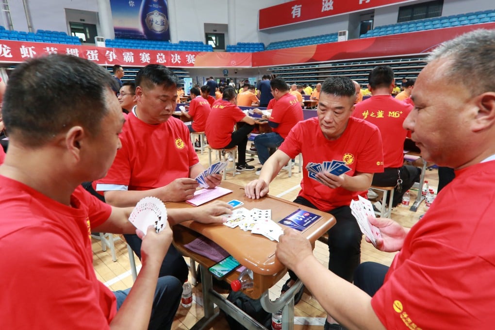 Players compete in a guandan competition in June last year in Huaian, Jiangsu province, the birthplace of the game. Photo: NurPhoto via Getty Images
