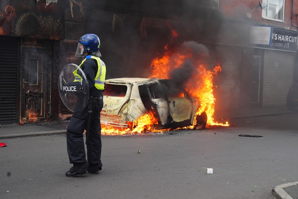 A car burns on Parliament Road in Middlesbrough during an anti-immigration demonstration at the weekend. Photo: PA Wire / dpa