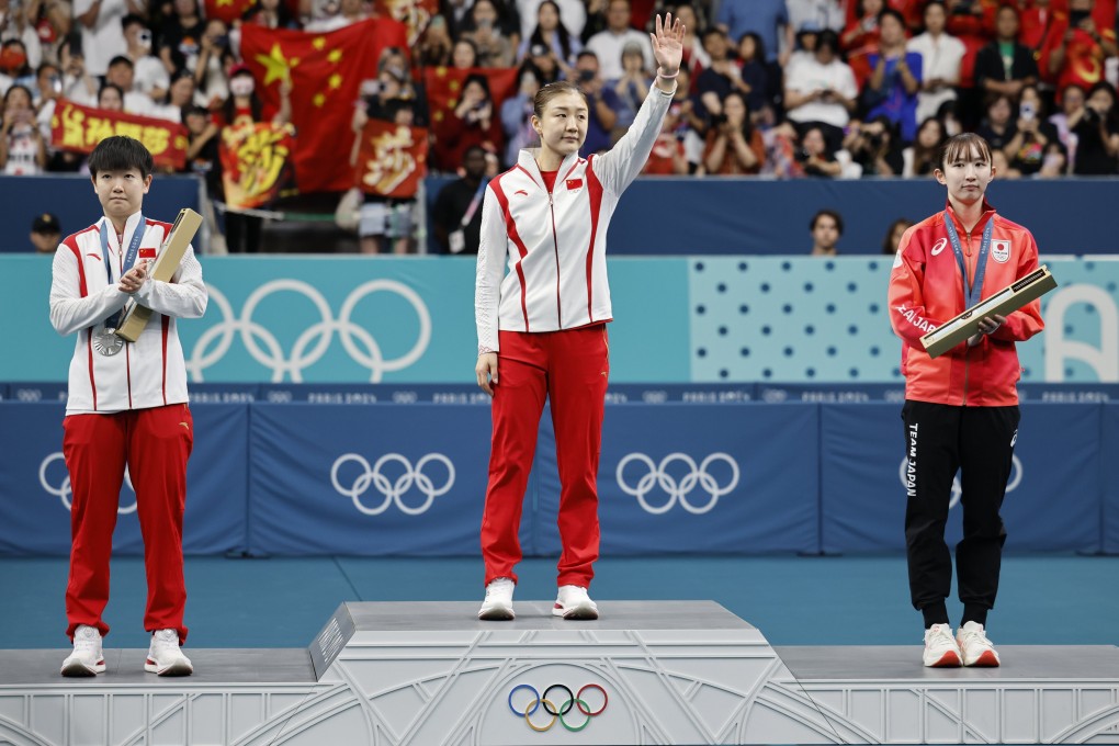 From left, table tennis players Sun Yingsha of China, Chen Meng of China and Shin Yu-bin of South Korea stand on the winner’s podium at the Paris Olympics on August 3. Photo: EPA-EFE