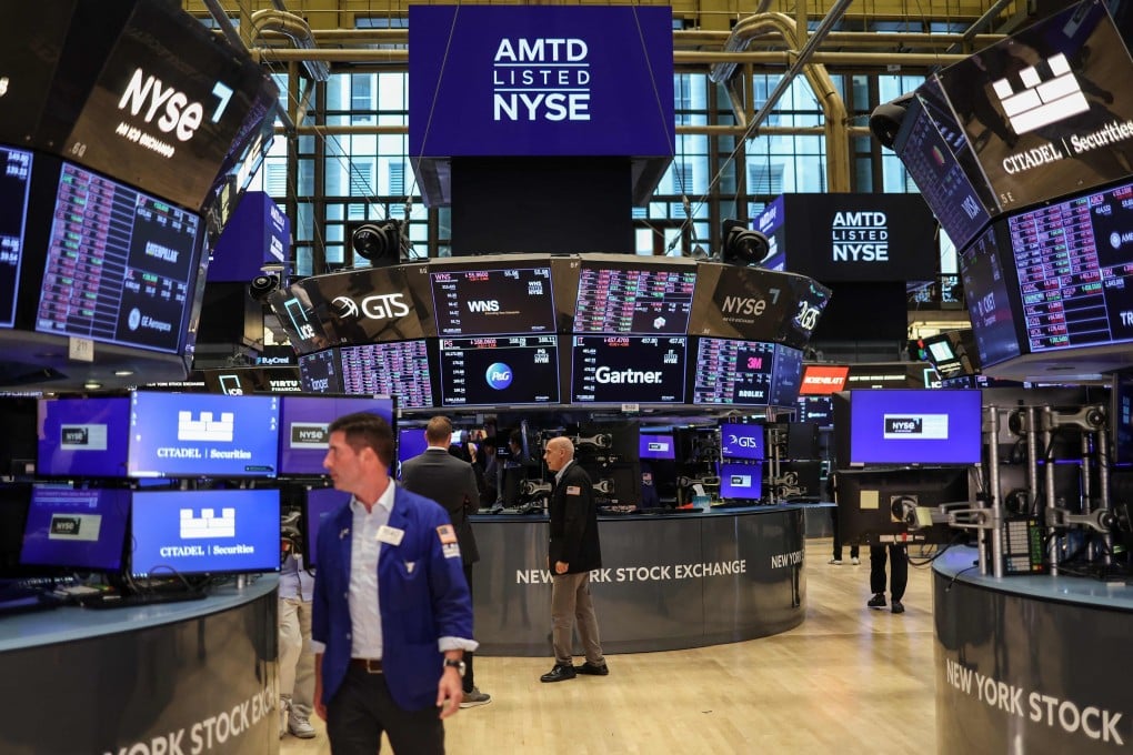 Traders work on the floor of the New York Stock Exchange ahead of the closing bell in New York on Monday. Photo: AFP