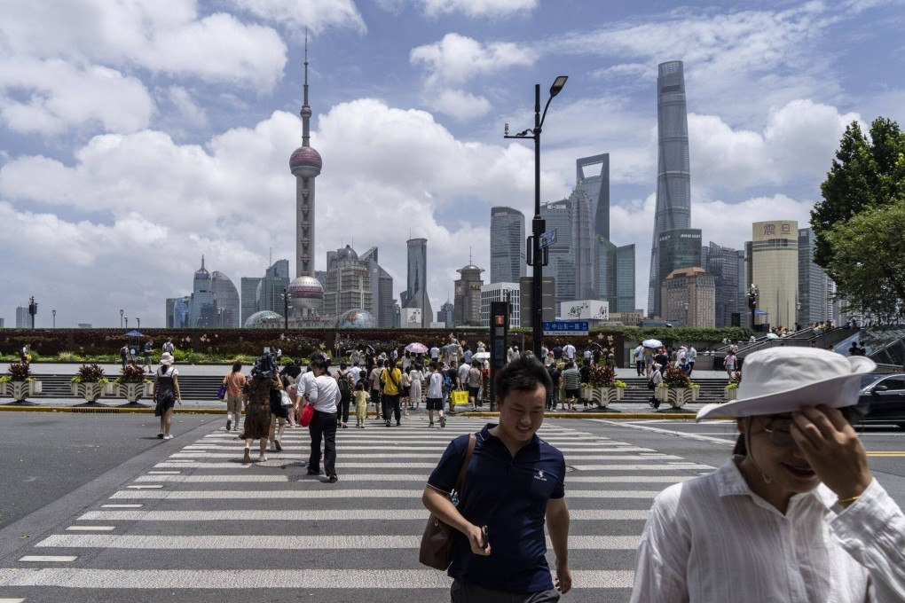 Pedestrians walk along the Bund in Shanghai on July 27, 2024. Photo: Bloomberg