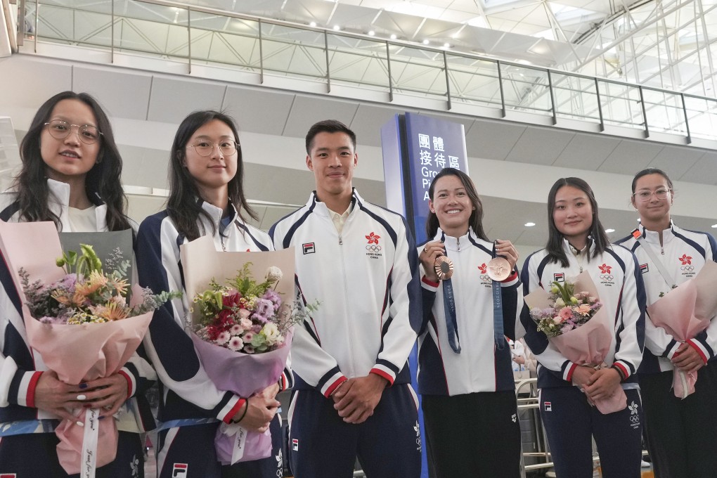 Hong Kong’s Olympic swimming team is seen on Tuesday in Hong Kong International Airport after their participation in the Paris Games. From left to right: Cindy Cheung Sum-yuet, Tam Hoi-lam, Ian Ho Yentou, Siobhan Haughey, Natalie Kan Cheuk-tung, Camille Cheng Lily-mei. Photo: Elson Li