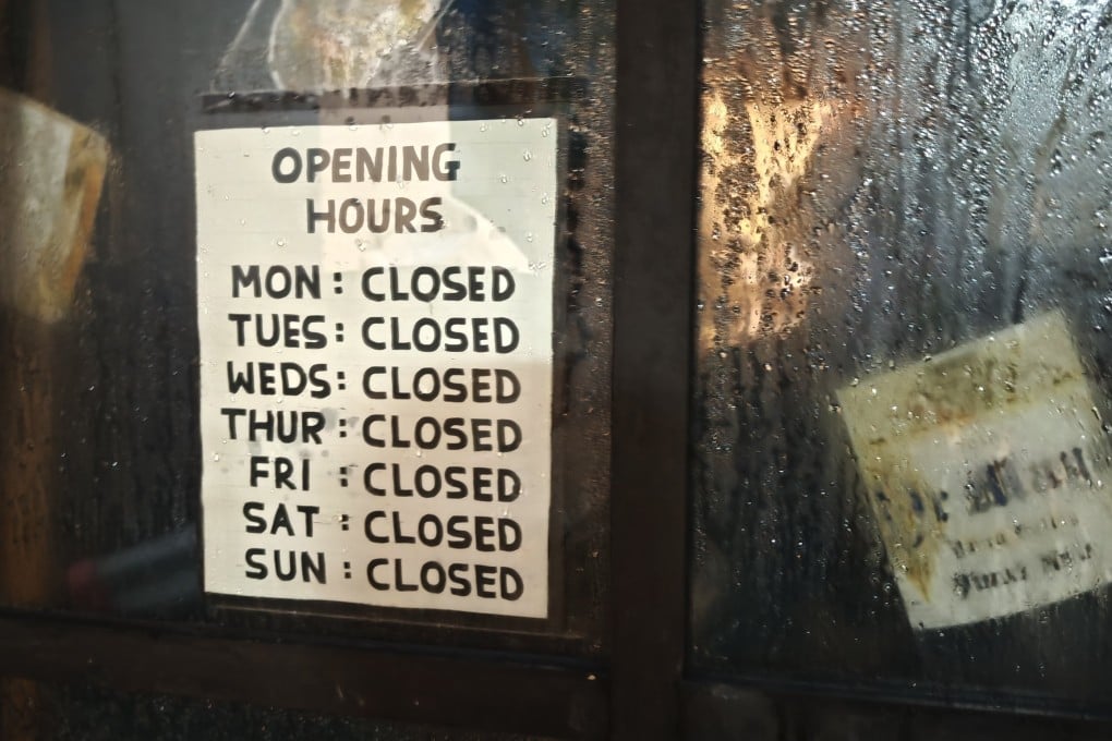 The door to the now-shuttered Oz Terroirs wine bar in Sheung Wan. The F&B industry is battling high costs, low-spending tourists and a tepid economic climate. Many restaurants and bars are closing as a result. Photo: Douglas Parkes