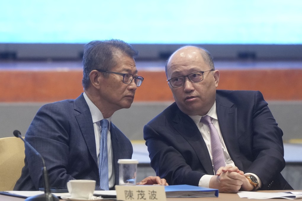 Financial Secretary Paul Chan and liaison office director Zheng Yanxiong, attend the seminar. Photo: Sam Tsang