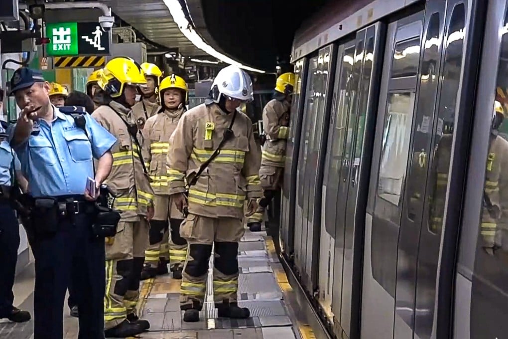 Smoke was seen emerging from underneath a train on Wednesday. Photo: Cable TV