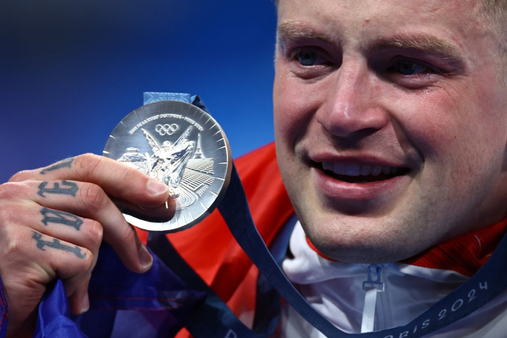 Adam Peaty of Britain displays his 100m breaststroke silver. Photo: Reuters