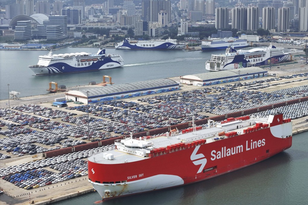 New cars wait for transportation near a Sallaum Lines ro-ro ship seen by the dock in Yantai in east China’s Shandong province. Photo: AP