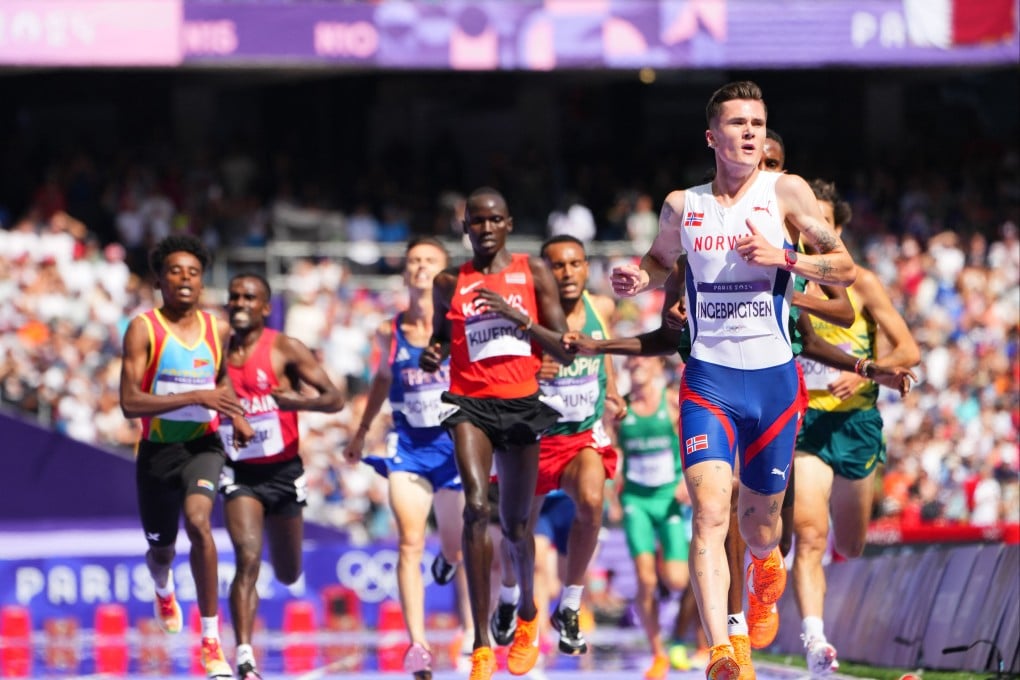 During the men’s 5000m heat, a cameraman casually crossed the track as the runners were approaching. Photo: Reuters